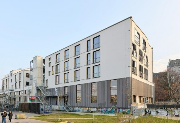 Exterior view of the modern white and grey multi-storey building at 28A, Rollbergstraße.