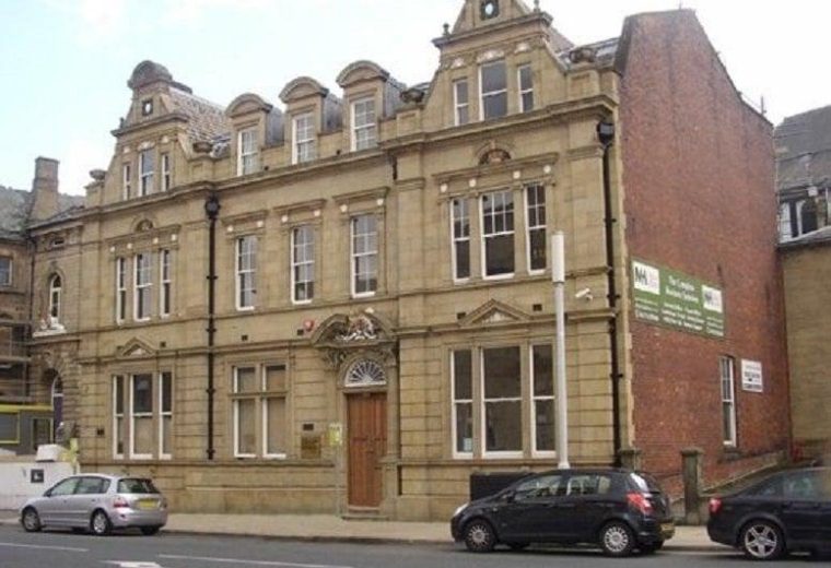 The classic stone exterior of 29 Manor Row, Bradford, showing its grand traditional architecture.