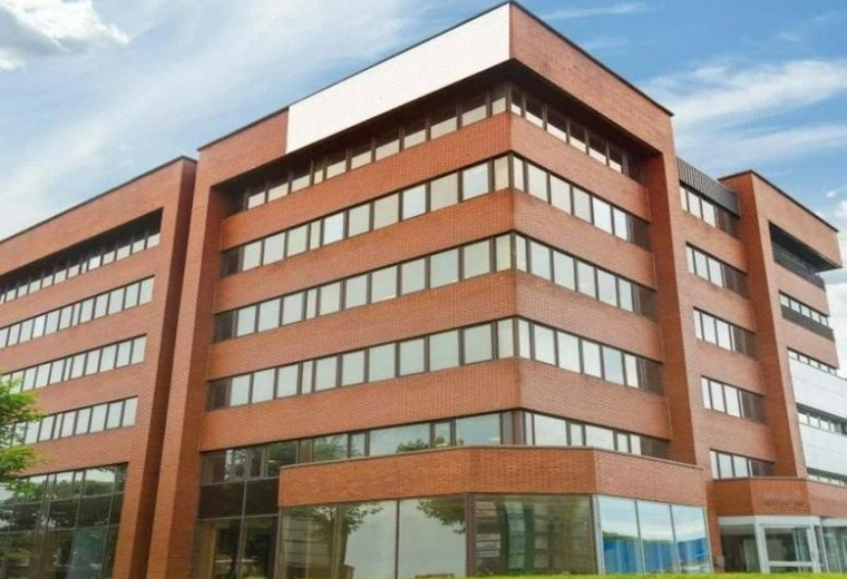 Exterior view of the modern red-brick facade at 333 Edgware Road, Colindale, London.