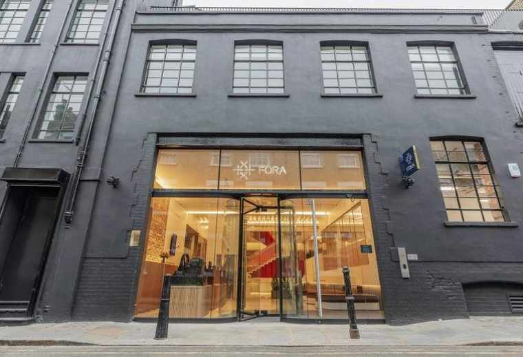 Exterior view of the dark grey brick facade and glass entrance at 42–46 Princelet Street.