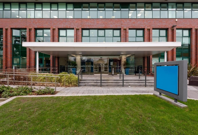 Exterior view of the brick facade and entrance at Adamson House, Towers Business Park.