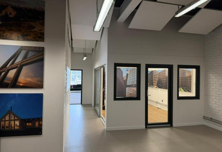 Spacious reception area at Crown Street with framed architectural photography and natural light.