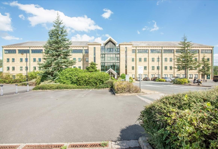 Exterior view of the multi-story stone facade at 1st floor East Suite, Waterfront, Salts Mill Road.