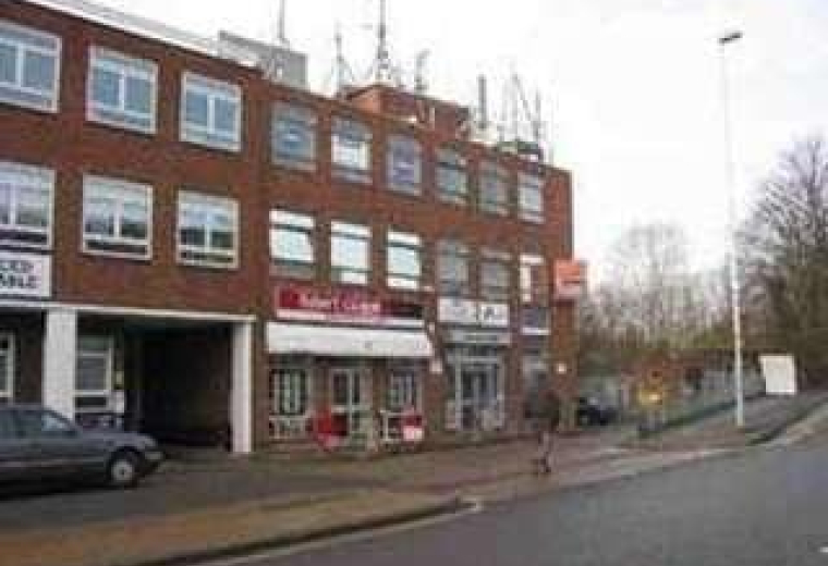 Exterior street view of the brick facade at Ferrari House, 258 Field End Road.