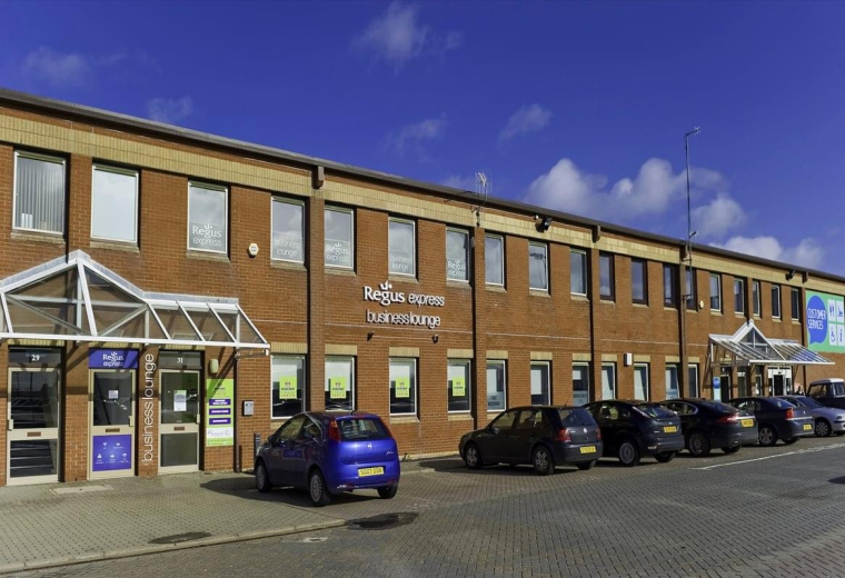 Wide exterior view of the brick facade at Fleming House, Fort Kinnaird Retail Park.