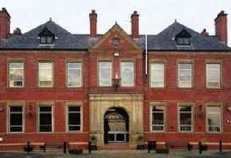 Symmetrical red brick exterior of the building at Lower Warrengate, Wakefield, Yorkshire, United Kingdom.