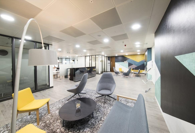 Bright, wide-angle lobby with stylish lounge chairs and designer lighting, One Kingdom Street, London, W2.