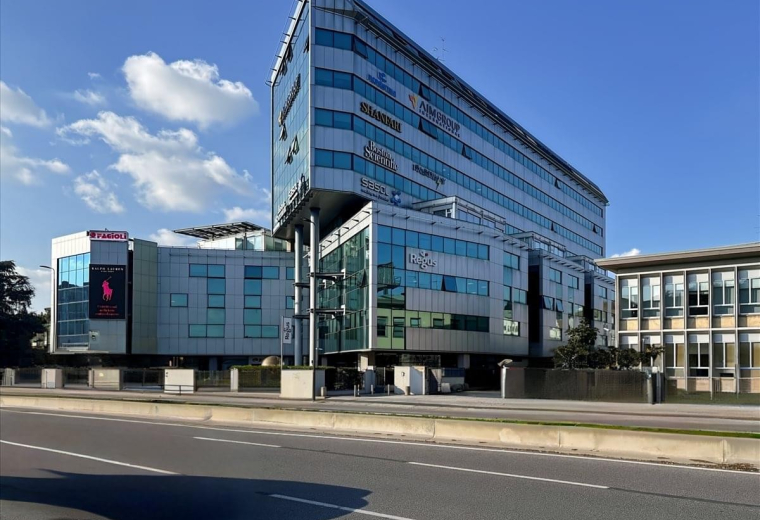 Street-level view of the contemporary Viale Enrico Forlanini 23 office building facade.