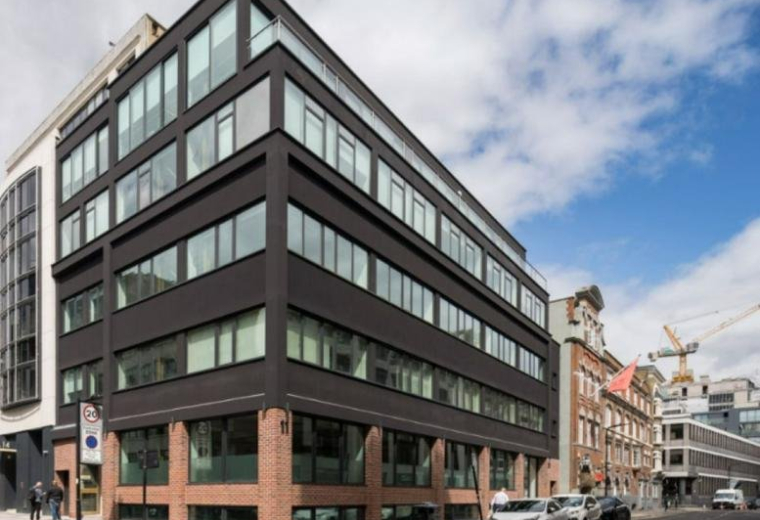 Modern black and brick exterior of the Paul Street, London, United Kingdom office building.