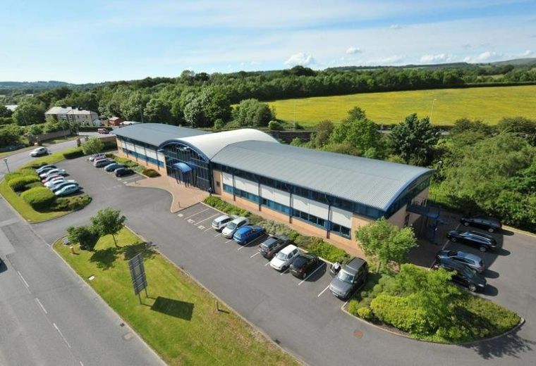 Aerial view of the curved-roof building at Ribble Court, 1 Mead Way, Shuttleworth Mead Business Park.