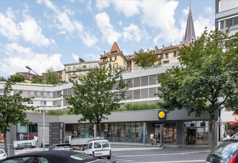 Exterior view of the building at Rue Saint-Martin 7, Lausanne, showing the facade and surrounding city architecture.