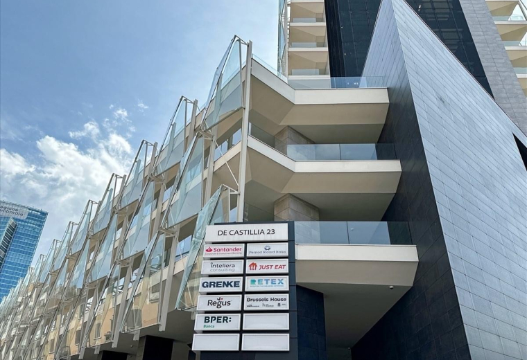 Exterior facade of the contemporary office building at Via Gaetano de Castillia, 23, Milan.