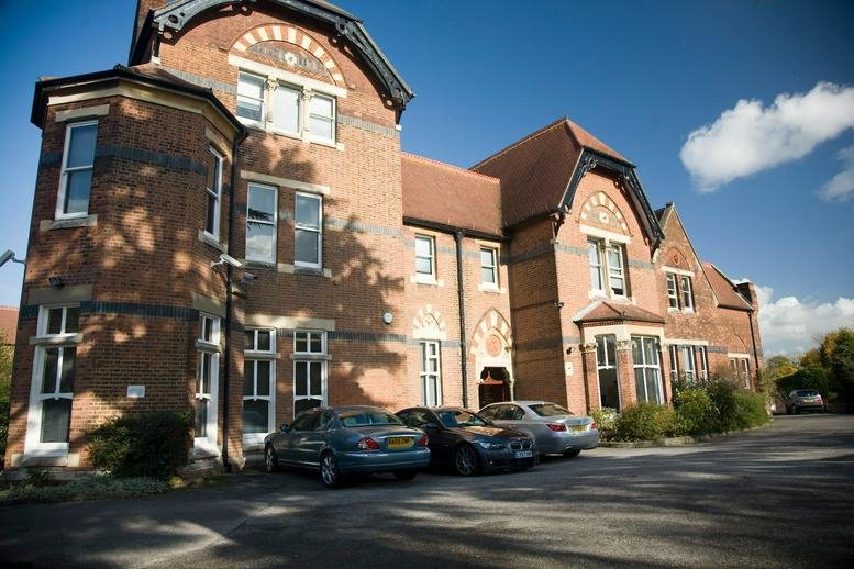 Exterior view of the red brick building at 1 Bromley Lane.