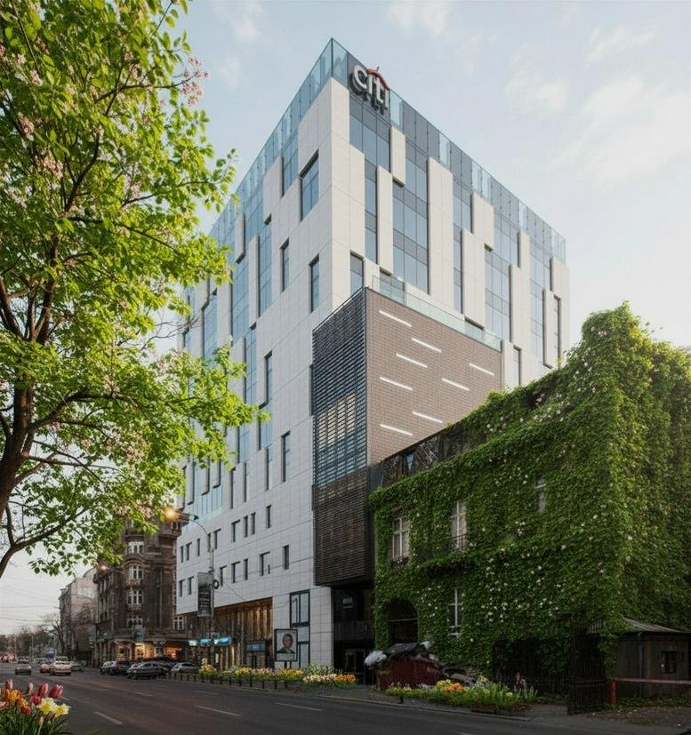 Exterior view of the contemporary glass and stone building at 145, Calea Victoriei.