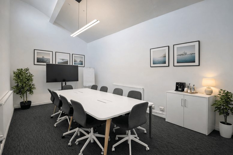 Lobby area with comfortable seating and a coffee station.