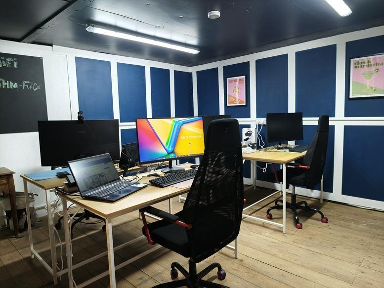 Spacious open-plan workspace at 15, Harold Mews, St. Leonards on sea with blue paneled walls.