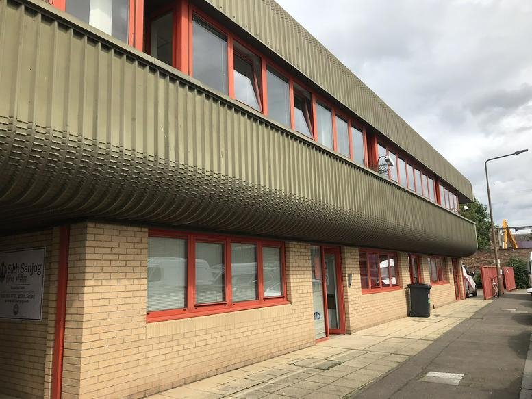 Exterior view of the industrial-style brick and metal building at 17b, Graham Street.