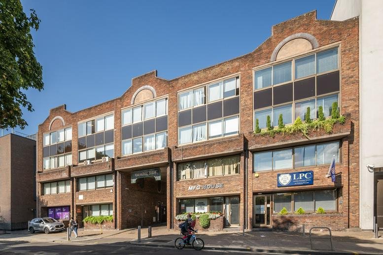 Exterior view of the brick facade building at 210, Shepherds Bush Road, Hammersmith.