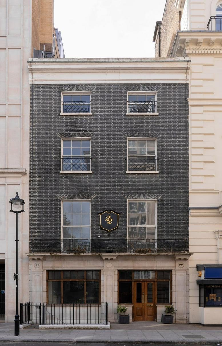 Exterior facade of the dark brick building at 22, Kingly Street.