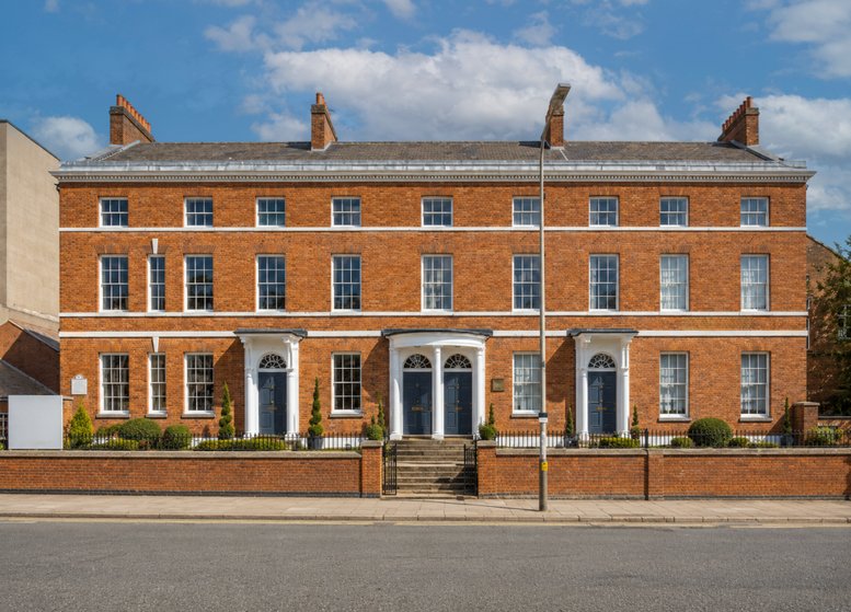 Exterior view of the red brick period building facade at 36-42, Humberstone Road.