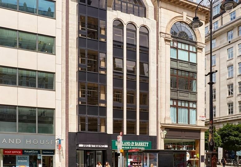 Exterior view of the multi-story stone and glass building at 390, Strand, Covent Garden.