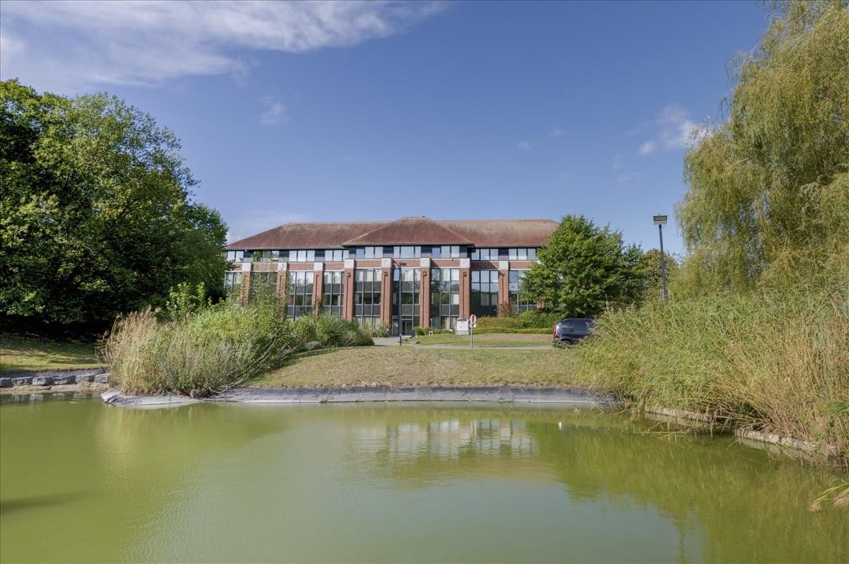 Exterior view of the brick and glass Building M at Waterloo Office Park.