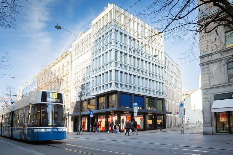 Exterior view of the modern white stone facade at 42, Bahnhofstrasse.
