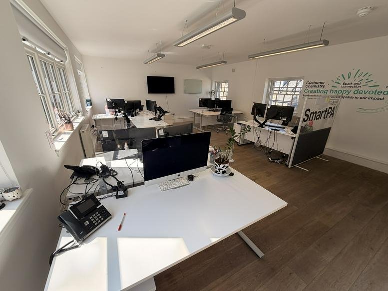 Spacious open-plan workspace at 7-13, Dublin Street Lane South with multiple white desks and large windows.