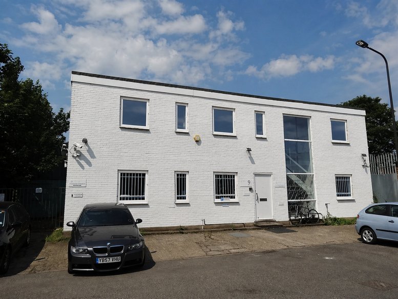 Exterior view of the white two-storey building at 9, Lyon Road with large windows.