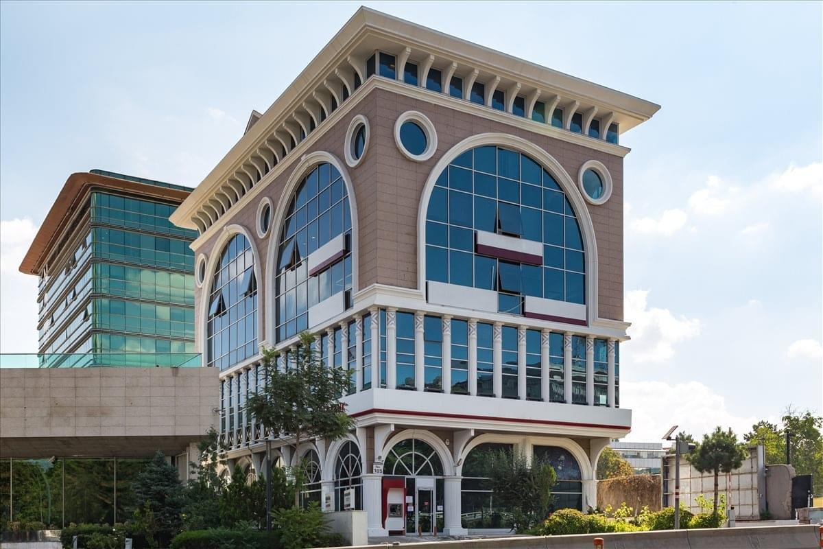 Exterior view of the arched facade of the building at Atatürk Blv No:185.