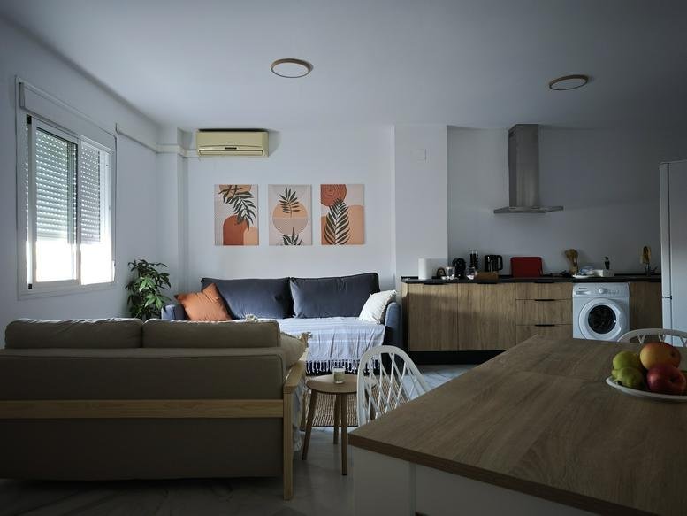 Spacious open-plan living area at Calle Doctor López Gómez,27 1B with a lounge, kitchen, and dining table.