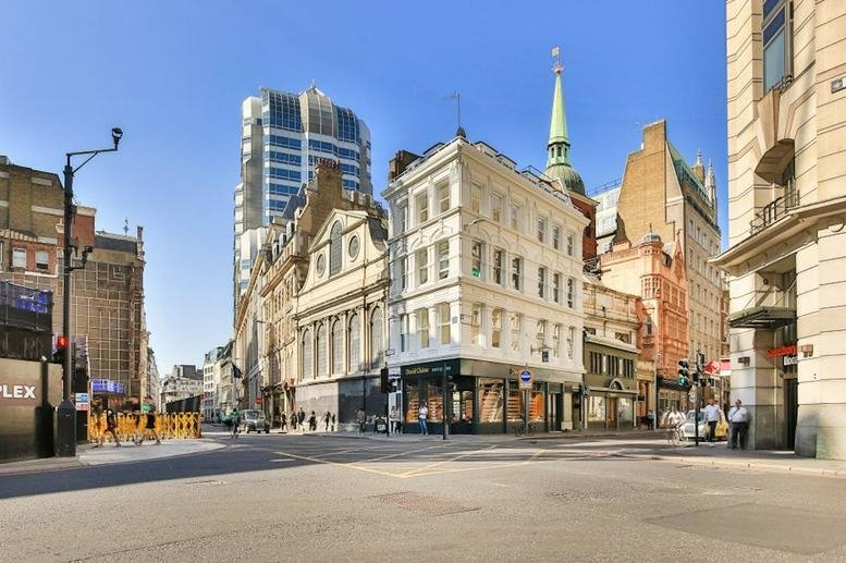 Exterior view of Cornhill House, 59 - 60 Cornhill Street, showing its white facade on a city corner.