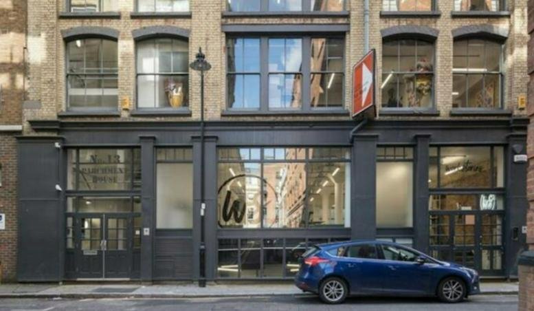 The brick and black industrial exterior of 13, Northburgh Street, London.