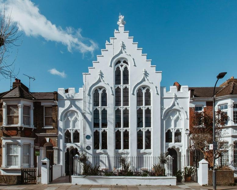 Exterior view of the white gothic-style building facade at 41 Iffley Road, Hammersmith, London.