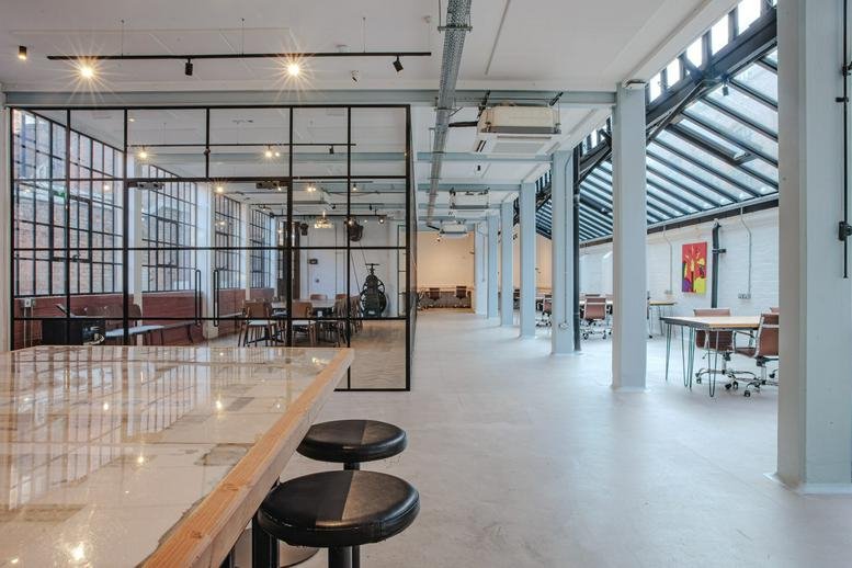 Spacious open-plan office at 62-64 Albion Street, Birmingham with industrial windows and glass partitions.