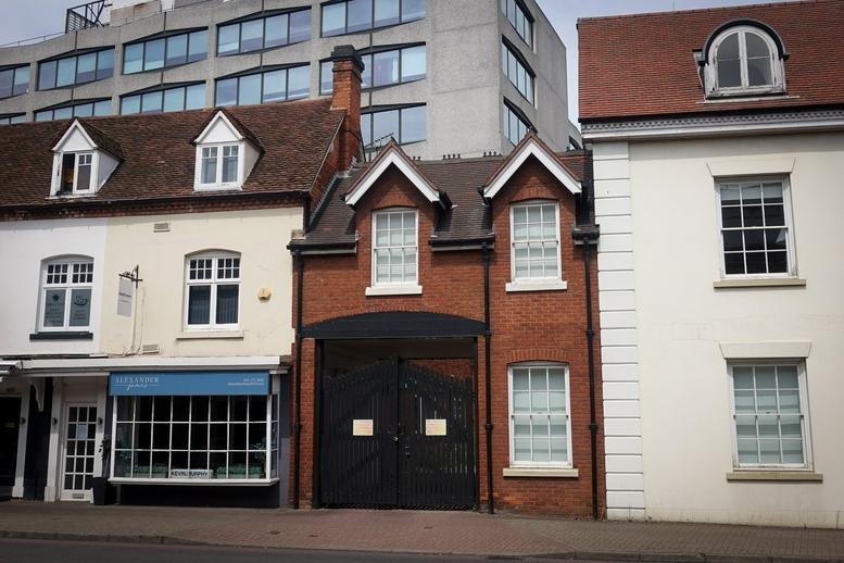Exterior view of the historic brick building at 699 Warwick Road, Solihull.