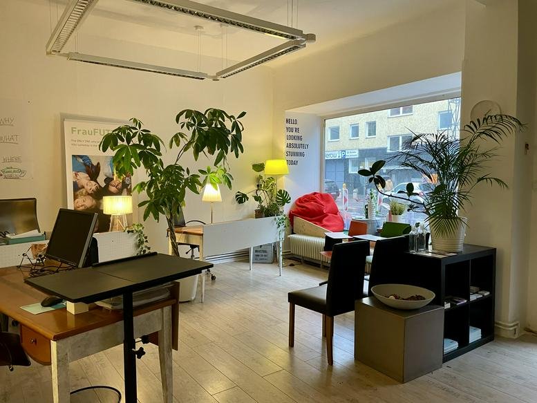 Spacious coworking area at 78, Silbersteinstraße, Berlin with large plants and natural light.