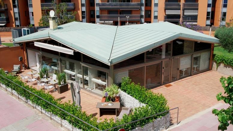 Exterior view of the modern glass-fronted building at Carrer de Narcís Macià i Domènech, 44.
