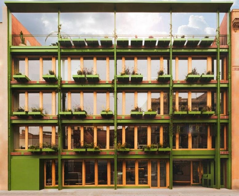 Exterior view of the green-framed facade at Carrer de Pere IV, 128, Ferreteria, Barcelona.