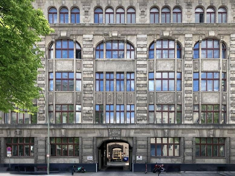 Grand stone facade and arched windows of the Lützowstrasse 102-104 building.
