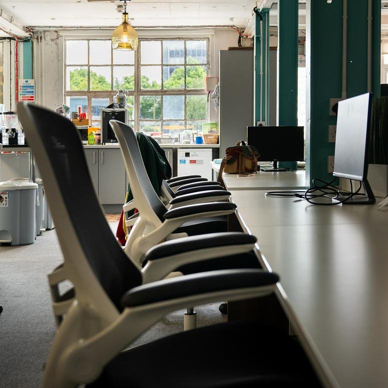 Modern open-plan workspace at Unit P5, Marina Commercial Park with ergonomic chairs and natural light.