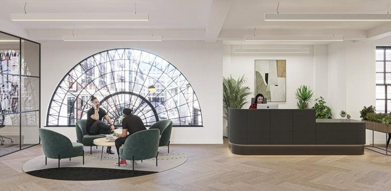 Bright reception area with a curved dark desk, velvet lounge chairs, and a large semi-circular window.