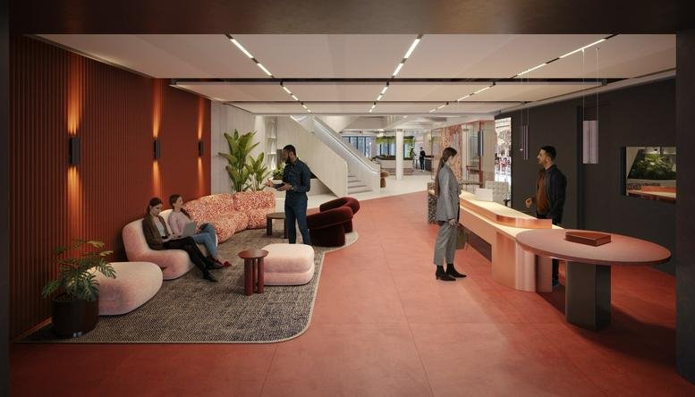 Spacious reception area at One New Change with a warm terracotta wall, pink velvet seating, and a sleek concierge desk.