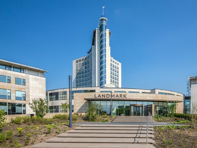 Exterior view of the Landmark building at Rijksweg-West 2 with its distinctive glass and white tower.