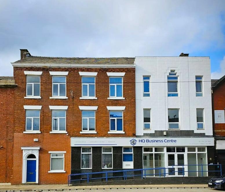 Exterior facade of the brick and white 123-127 Union Street business center.