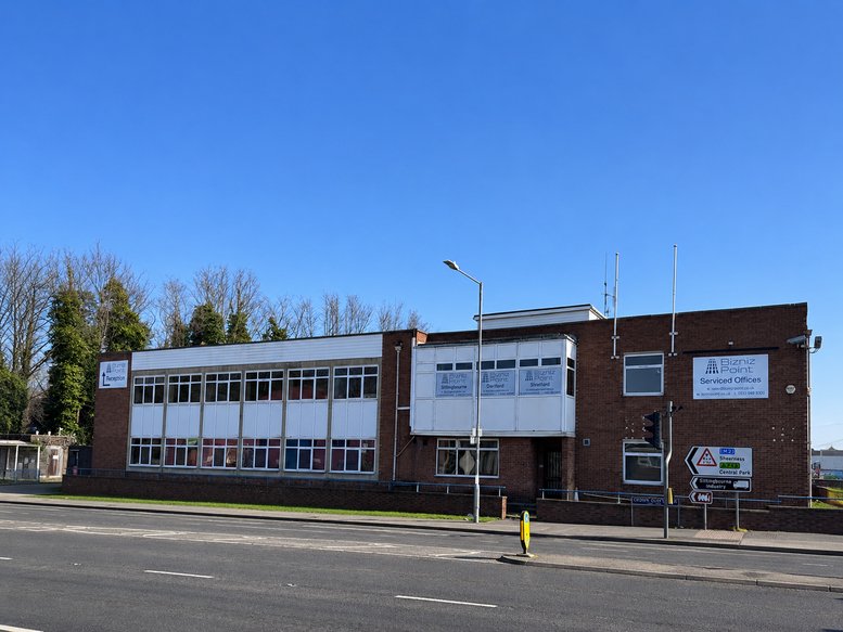 Wide exterior view of the brick and white facade of Grid House, Crown Quay Lane.