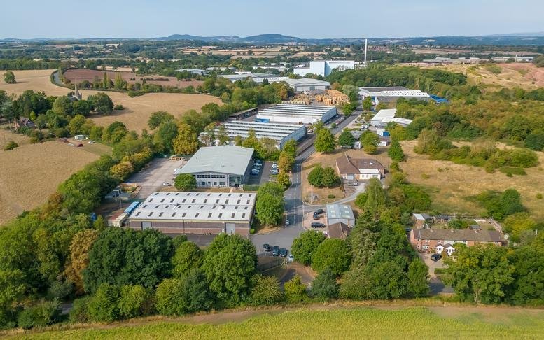 Aerial view of the industrial units and surrounding greenery at Hartlebury Trading Estate.