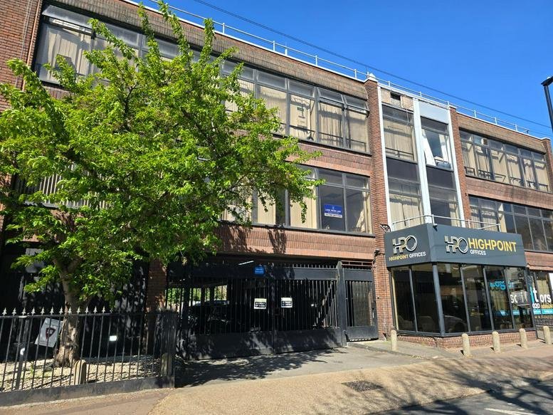 Exterior view of the brick facade and entrance at Heron House, 2 Heigham Road.