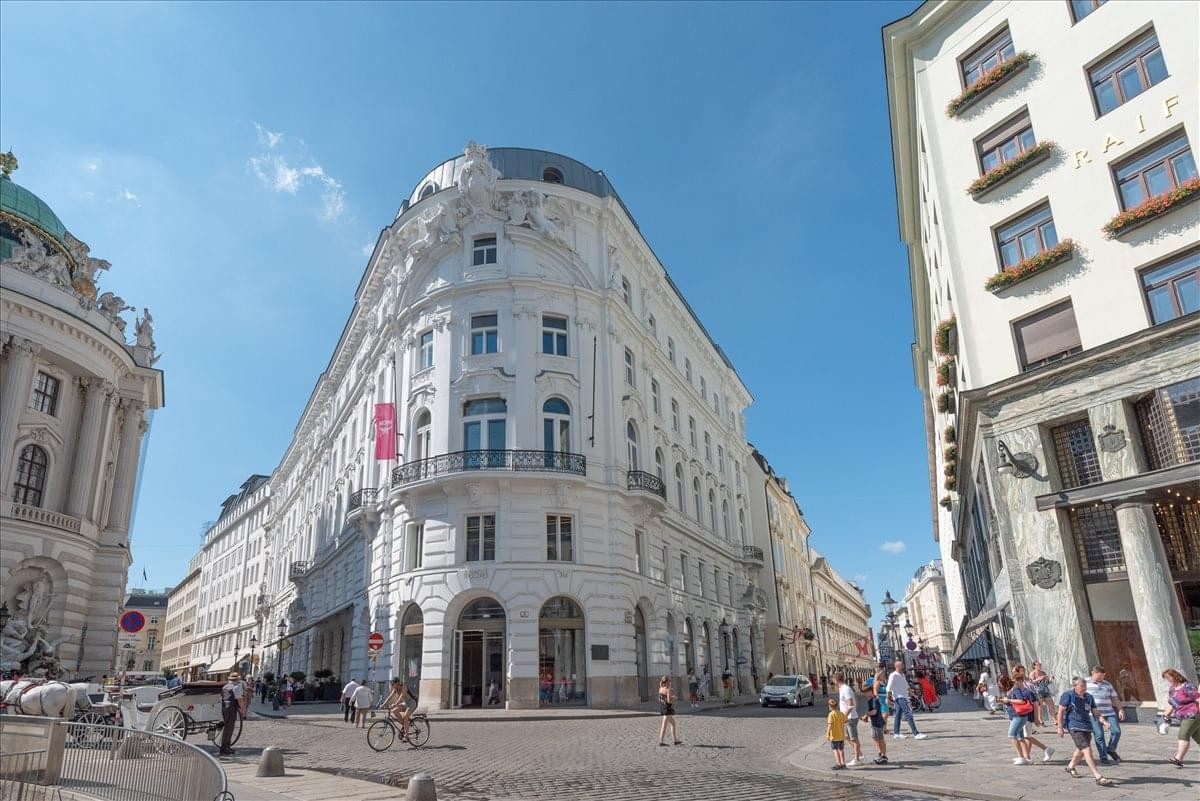 Exterior view of the Herrengasse 1-3 building with historical architecture.