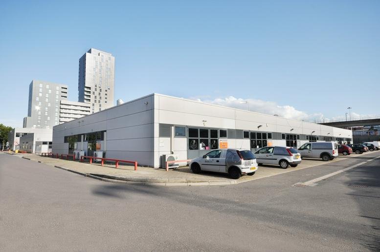 Exterior view of the modern light-colored warehouse units at Poplar Business Park, 10 Prestons Road.